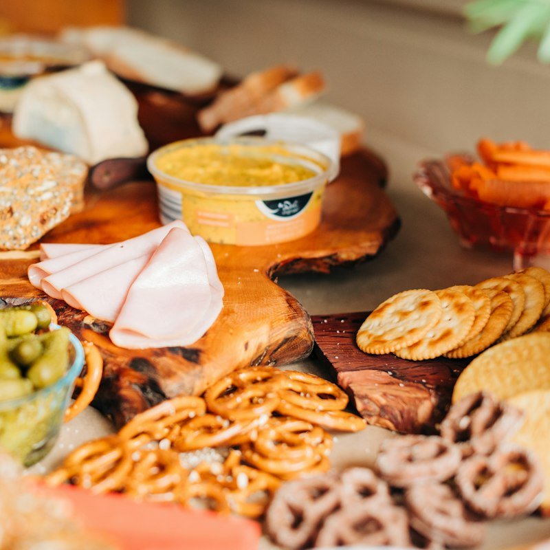 Grazing spread with dips, pickles, cheese and crackers