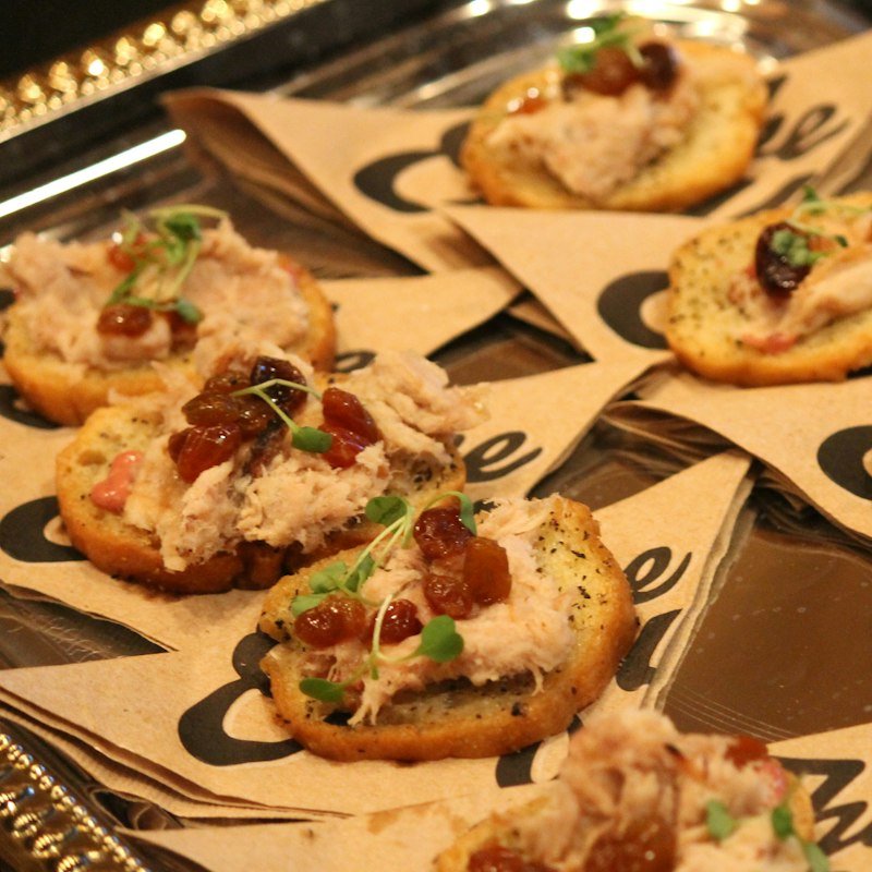 Crostini with creamy topping and fresh herbs